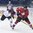 POPRAD, SLOVAKIA - APRIL 14: Latvia's Niks Krollis #26 stick checks Switzerland's Justin Sigrist #15 during preliminary round action at the 2017 IIHF Ice Hockey U18 World Championship. (Photo by Andrea Cardin/HHOF-IIHF Images)

